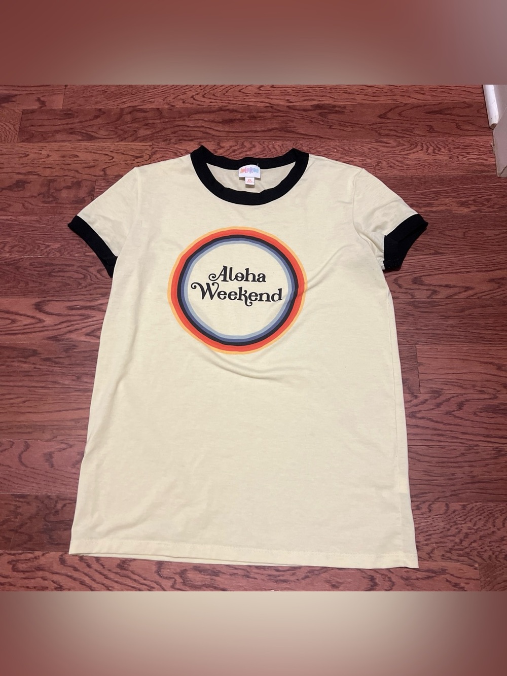 LuLaRoe Short Sleeve Tee - Cream with Black Trim and Orange/Blue Graphic